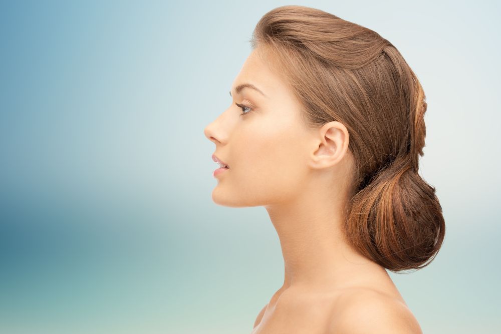 profile of a beautiful young-looking woman after face and neck rejuvenation