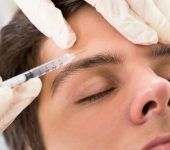 Young Man Having Botox Treatment